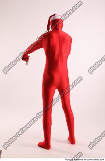 JOEL_ADAMSON CHRISTMAS VALLAIN WITH GUN AND BAG